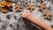 Child hand drawing in the flour of christmas cookies