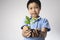 Child hand holding litter plant