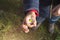 CHILD HAND HOLDING A SINGLE SMALL DAISY FLOWER