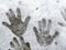 child hand prints in the snow. The impact of human heat on snow. A handprints on a slightly melted snow, concept beginning of wi