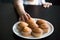 Child hand taking muffins on table close up