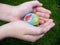 Child handing a globe.