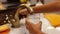 Child hands filling glass with water