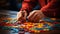 Child hands folding multicolored puzzle at table closeup