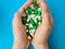 Child hands hold many colorful vitamin capsules supplements tablets