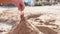 Child hands making sand towers on beach in summer sunny day Sand castle build