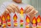 Child hands putting a paper flame on handmade hanukah