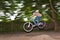 Child has fun jumping with the bike over a ramp