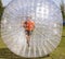 Child has fun in the Zorbing Ball