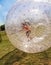 Child has fun in the Zorbing Ball