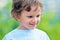 Child has summer joy. International childrens day. Closeup of cute young boy. Portrait of little boy posing outside