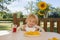 Child, having breakfast in the morning, sitting on porch of camping van, traveling summer time