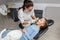 Child having dental check up by specialist in dentist office