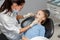 Child having dental check up by specialist in dentist office