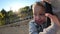 Child having exciting experience on a rope swing on the playground