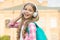 Child headphones listen music. Audio book concept. Studying audio lessons. Listen music while walking. Girl headphones