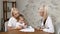 Child Health Examination. Young mother and her little pretty daughter visit pediatrician. Friendly child health clinic