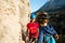 The child in helmet is instructed to go through the climbing route