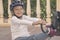 Child helmet for rollers, Pretty little girl learning to roller skate outdoors, Happy girl, Have a free time, summer