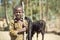 Child herdsman with cattle in search of feed