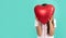 child hiding behind heart balloon. happy valentines day. be my valentine. teen girl