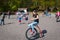 Child on a high wheel bicycle in the open air museum in Arnhem, the Netherlands