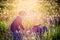 Child and his dog in white dandelion meadow