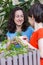 A child with his mother is choosing home plants in the store