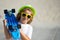 Child hold skateboard on a sunny day in the park. Outdoor portrait od little skateboarder. Child riding skateboard in