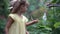 Child Holding Butterfly Speckled Wood. High quality 4k footage