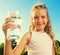 Child holding glass with water