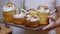 Child Holding Many Easter Cakes on a Tray, Standing in the Kitchen. Close-up