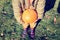 Child holding pumpkin, autumn harvest