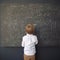 A child holding a whiteboard with a complex equation on it to represent the struggles of those with learning