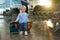 Child, holdking suitcases, traveling with family, waiting at the airport to board the aircraft