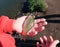 The child holds in the palm of a carp, which was caught in the pond of the city Park. City Park on a Sunny autumn day. hobby fishi