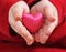 Child holds satin valentine heart