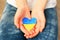 A child holds a Ukrainian heart in his hands