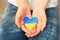 A child holds a Ukrainian heart in his hands