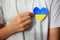 A child holds a Ukrainian heart in his hands