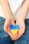 A child holds a Ukrainian heart in his hands