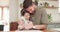 Child, homework and dad hug from student education help in notebook with knowledge development. Paper, study and father