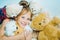 Child hugging teddy bear. Toys dream. Kid girl dreams near tiys teddy. Childhood dream. Daydreamer child. Dreams and