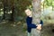 Child hugging a tree in a dark forest  taking care of the planet