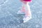 Child ice skating on frozen river. Kids skate