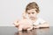 Child inserting coins in a piggy bank