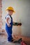 Child installing electric cables and sockets at home.