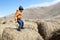 Child jumping on bale of hay