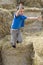 Child jumping in haystack