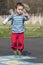 Child jumping hopscotch